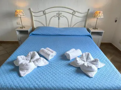 Letto o letti in una camera di Villa Laura Tanca Piras