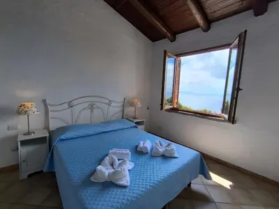 Letto o letti in una camera di Villa Laura Tanca Piras