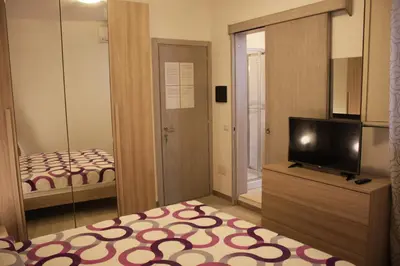 Letto o letti in una camera di B&B Castello Salvaterra