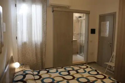 Letto o letti in una camera di B&B Castello Salvaterra