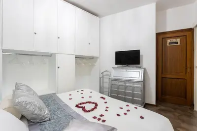 Letto o letti in una camera di Cagliari Centro Città Rooms