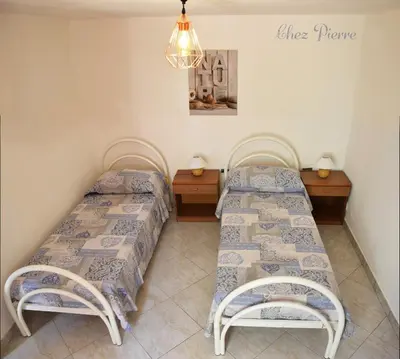 Letto o letti in una camera di Chez Pierre