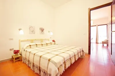 Letto o letti in una camera di Pinus Village Sea Front Apartment