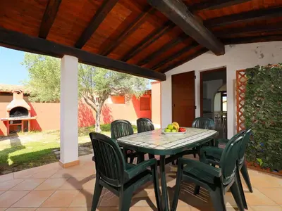 Patio o area all'aperto di Holiday Home Ville San Pietro - REI355 by Interhome