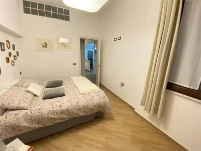 Letto o letti in una camera di Casa Anacleto