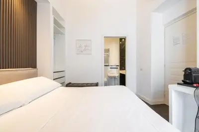 Letto o letti in una camera di PLEY Cagliari Boutique Suites