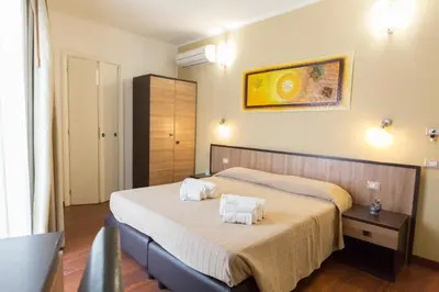 Letto o letti in una camera di Lewisrooms Domo