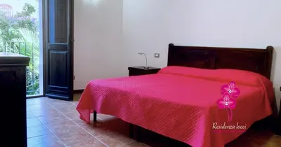 Letto o letti in una camera di Residenza Locci - Rooms & Apartments