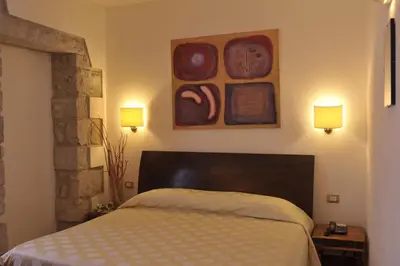 Letto o letti in una camera di Hotel Villa Pimpina