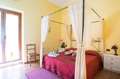 Letto o letti in una camera di B&B L'Albero Dei Limoni