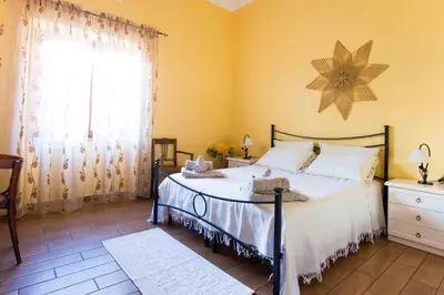Letto o letti in una camera di B&B L'Albero Dei Limoni