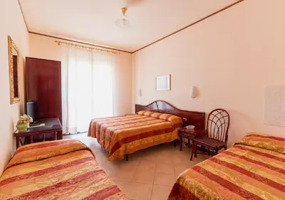 Letto o letti in una camera di Hotel Villa Delle Rose