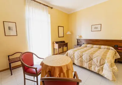 Letto o letti in una camera di Hotel Villa Delle Rose