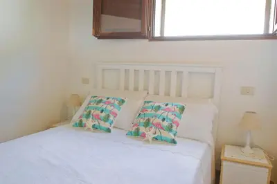Letto o letti in una camera di Jungle House - Pineta Is Morus