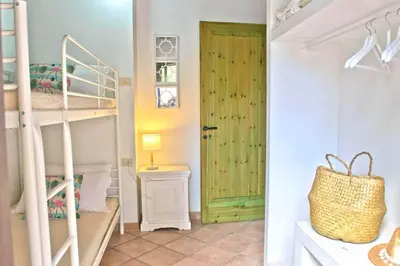 Letto o letti in una camera di Jungle House - Pineta Is Morus