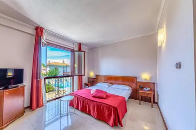 Letto o letti in una camera di Hotel Le Torri