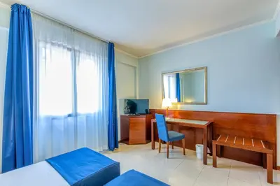 Letto o letti in una camera di Hotel Le Torri