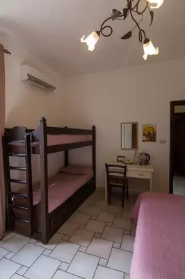 Letto o letti in una camera di B&B Del Viale