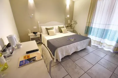 Letto o letti in una camera di Hotel I Graniti