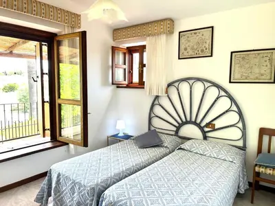 Letto o letti in una camera di VILLA REMILIA a 600 m dal mare di Tortolì