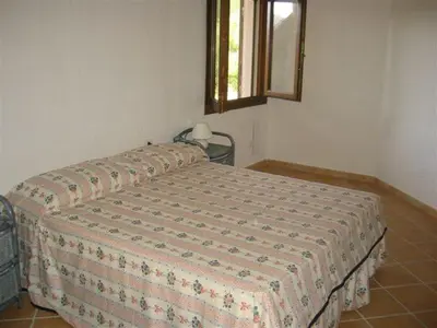 Letto o letti in una camera di VIlla Lentisco