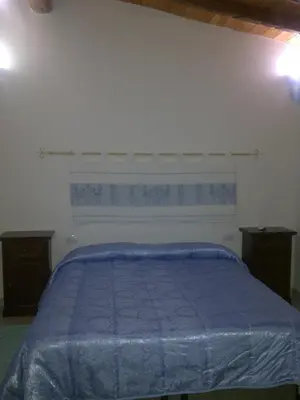 Letto o letti in una camera di La Quercia