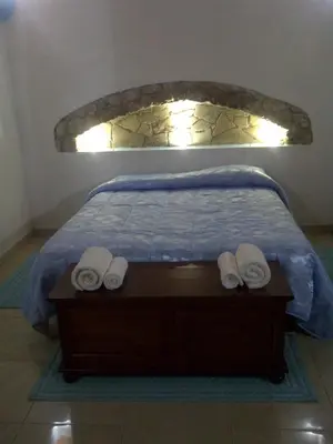 Letto o letti in una camera di La Quercia