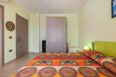 Letto o letti in una camera di L'arcobaleno di Chia CIN IT11101CE