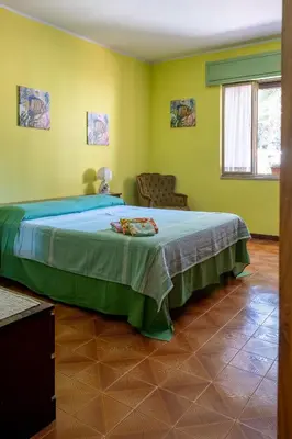 Letto o letti in una camera di Villa Mariuccia
