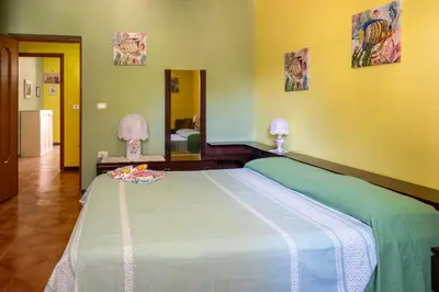 Letto o letti in una camera di Villa Mariuccia