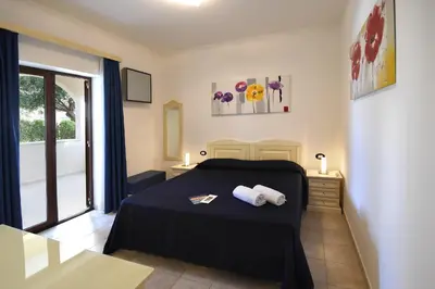 Letto o letti in una camera di Hotel Ristorante Il Vascello
