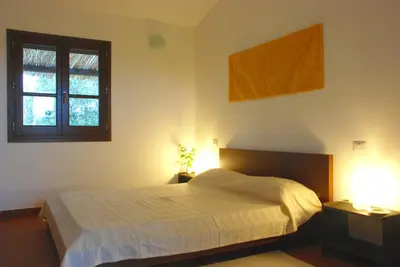 Letto o letti in una camera di B&B Sa Ingia