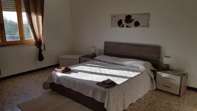 Letto o letti in una camera di villa sul mare a Chia