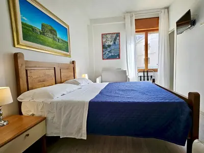 Letto o letti in una camera di Affittacamere Miri