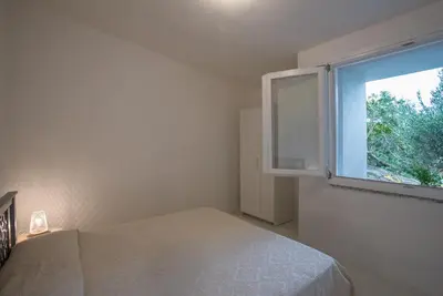 Letto o letti in una camera di Sul Mare Sardegna Villa Calipso