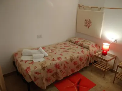 Letto o letti in una camera di Casa Alessia