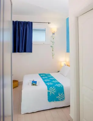 Letto o letti in una camera di Hotel La Villa Del Mare