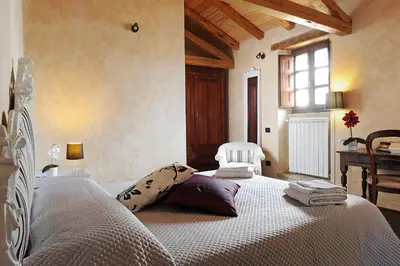 Letto o letti in una camera di Antica Locanda Lunetta