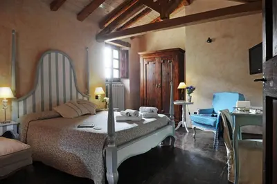 Letto o letti in una camera di Antica Locanda Lunetta