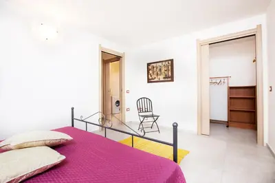 Letto o letti in una camera di Villino Enzo 350 mt Baia di Porto Frailis