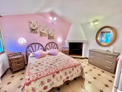 Letto o letti in una camera di Porto Pino Villa Mimosa