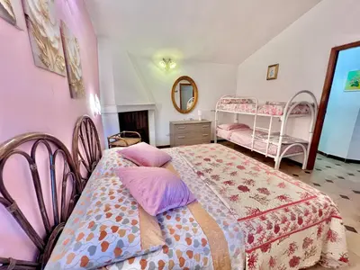 Letto o letti in una camera di Porto Pino Villa Mimosa