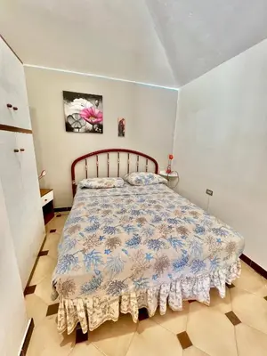 Letto o letti in una camera di Porto Pino Villa Mimosa