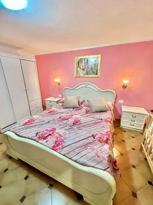 Letto o letti in una camera di Porto Pino Villa Mimosa