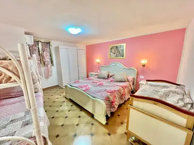 Letto o letti in una camera di Porto Pino Villa Mimosa