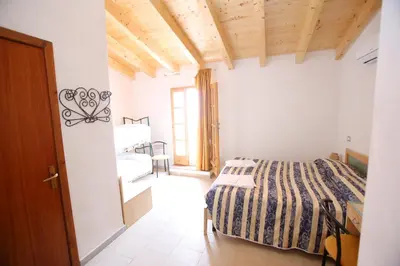 Letto o letti in una camera di Hotel Paola