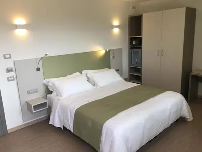 Letto o letti in una camera di Hotel Stele di Nora
