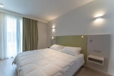 Letto o letti in una camera di Hotel Stele di Nora