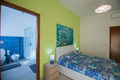 Letto o letti in una camera di Sandalia B&B