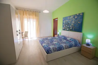 Letto o letti in una camera di Sandalia B&B